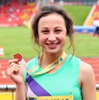 Kristie Edwards with her bronze medal from the Inter Girls 100 metres.